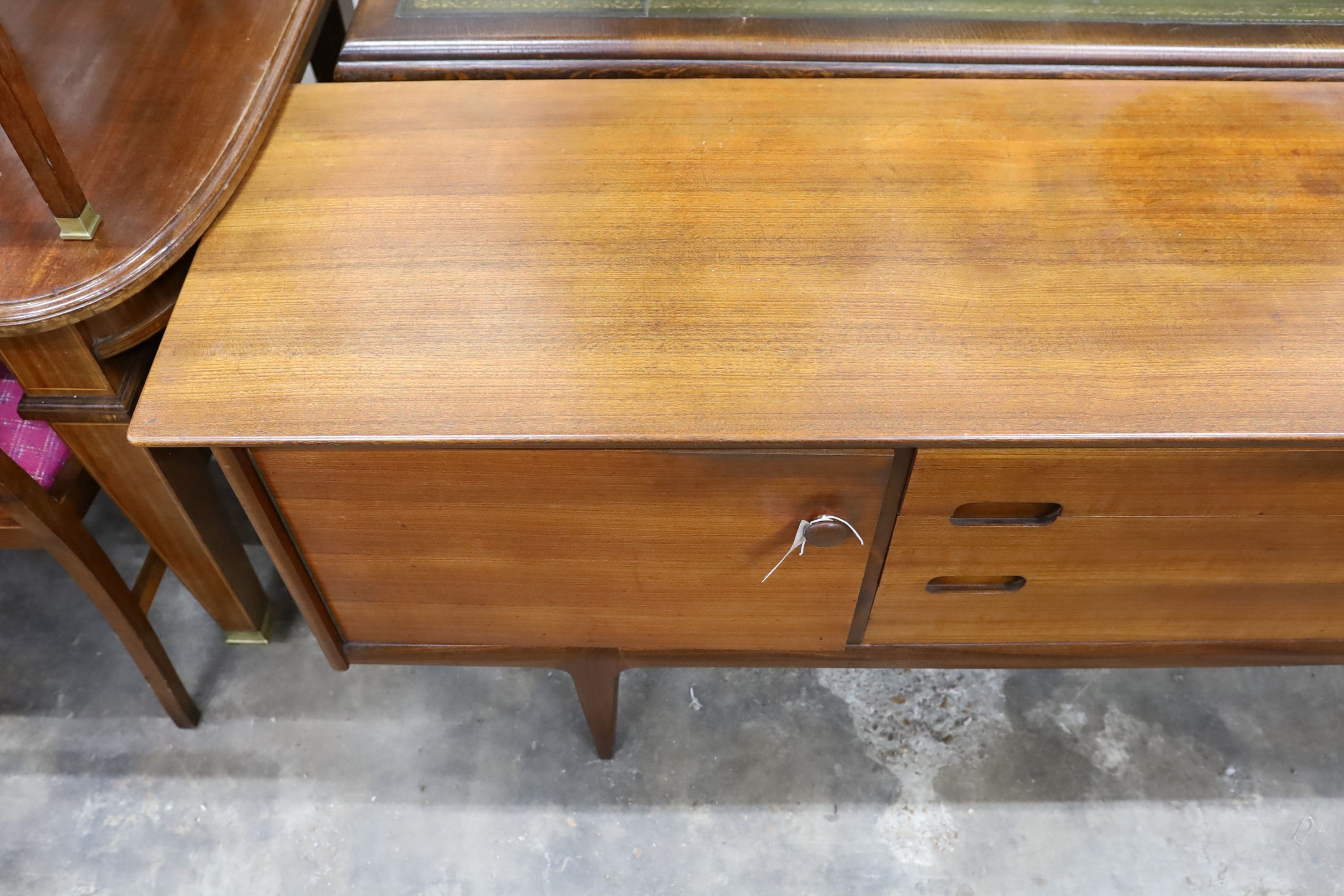 A mid century design teak sideboard, length 209cm, depth 49cm, height 75cm